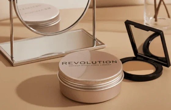 Makeup Revolution Balm Glow natural nude balm and compact powder with mirror on beige surface