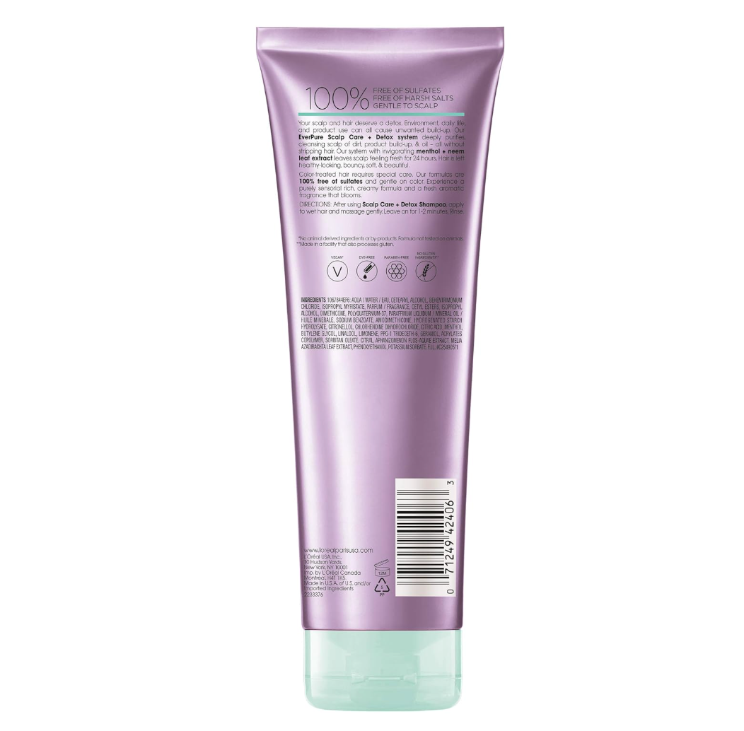 Back of a purple hair care product tube with ingredients and vegan, sulfate-free labels.