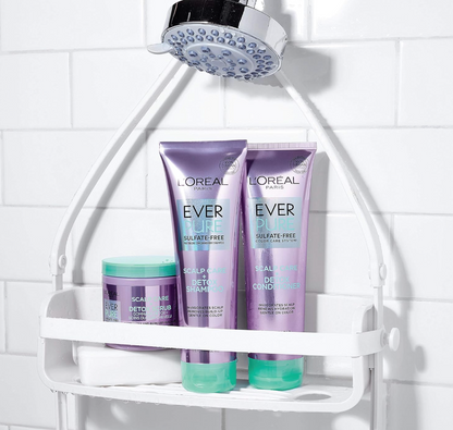 L'Oreal Paris Ever Pure scalp care shampoo, conditioner, and scrub on a shower shelf