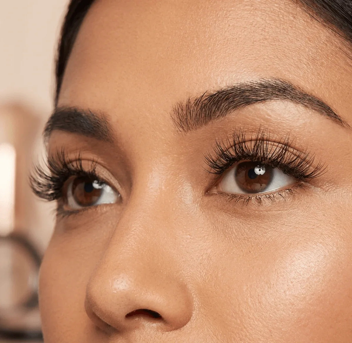 Close-up of eyes wearing natural wispy false eyelashes, soft makeup look