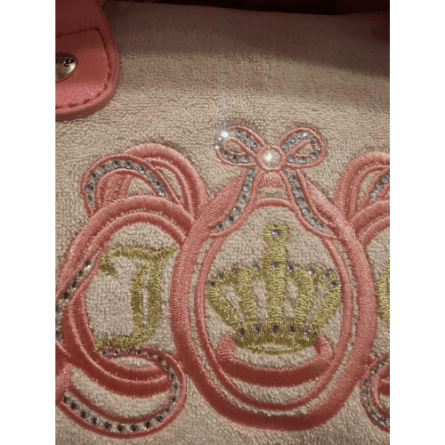 Juicy Couture fans, birthday gifts, special occasions, or anyone who loves a touch of princess sparkle.