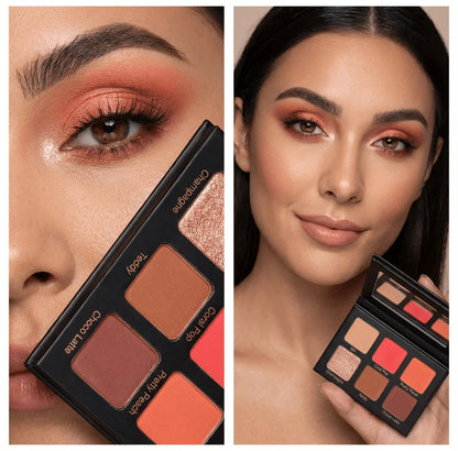 Woman with coral and peach eyeshadow look holding Violet Voss Coral Pop mini eyeshadow palette
